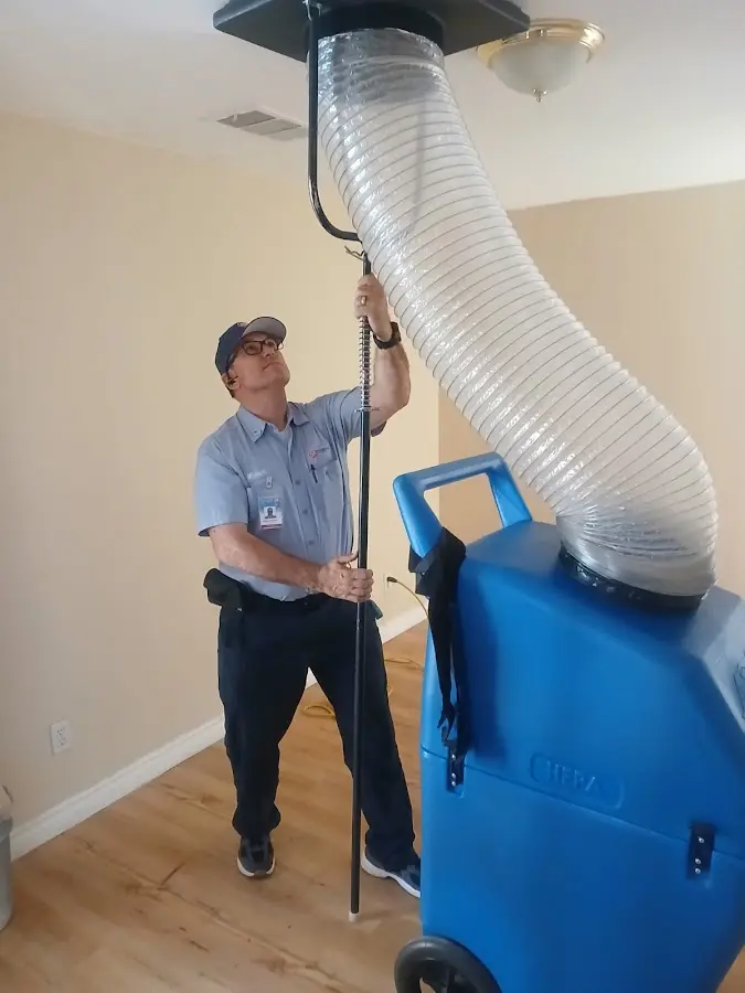 Furnace Tune-Up technician using HEPA equipment in Citrus Hills