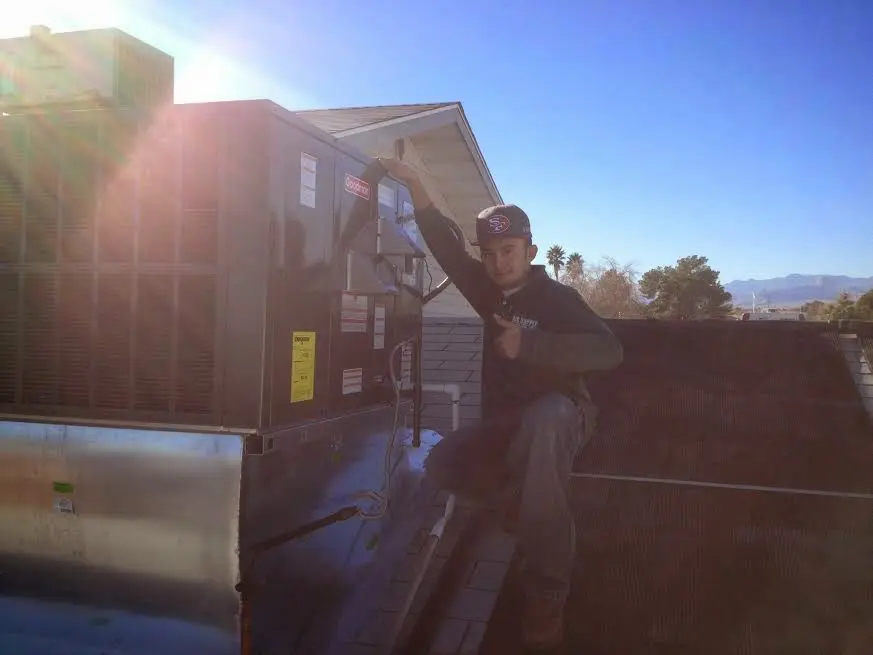 HVAC technician performing HVAC Inspection on a rooftop unit in Citrus Hills
